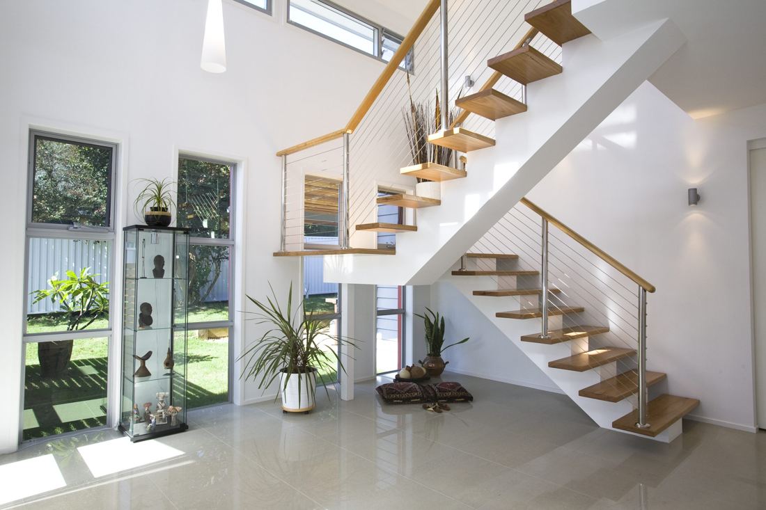 Floating timber staircase with a glass balustrade