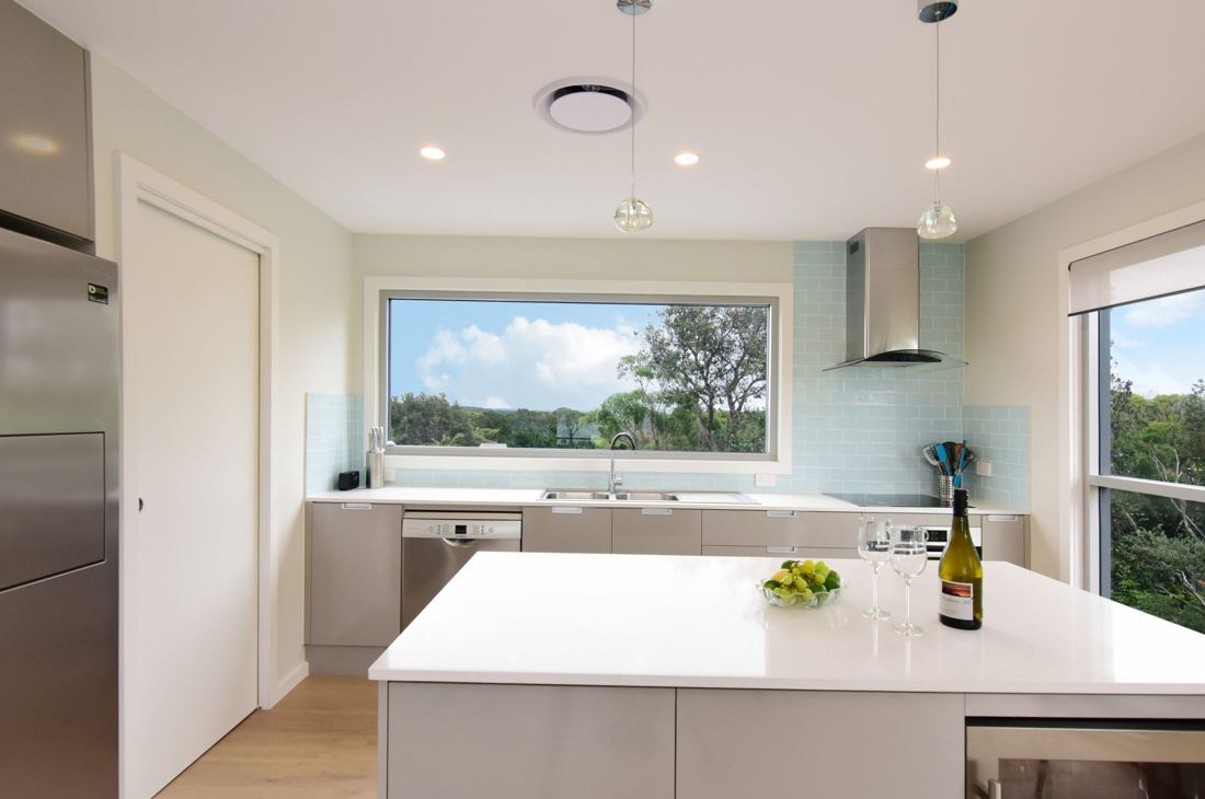 Bright kitchen with a white island bench